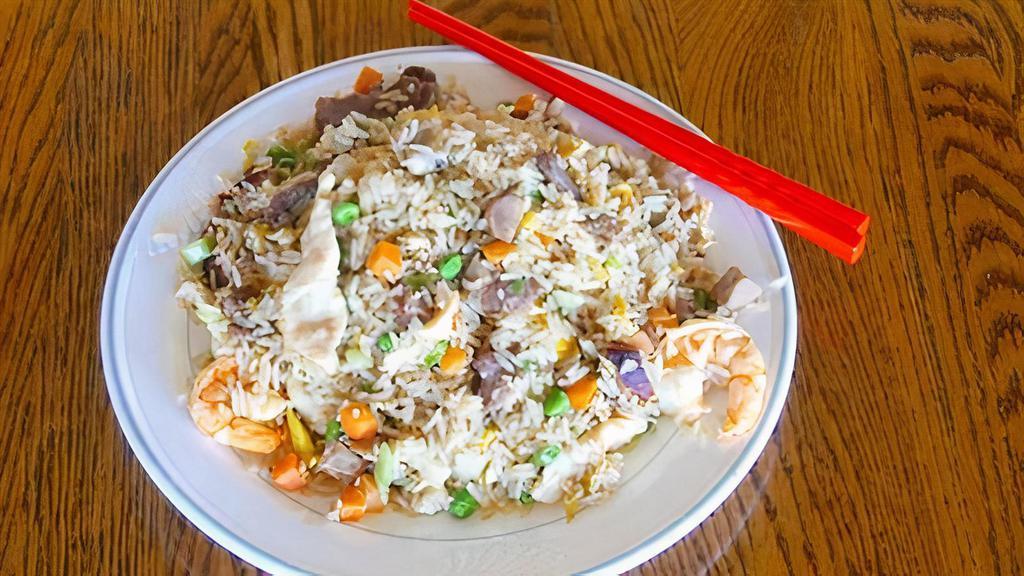 House Fried Rice (Shrimp, Chicken, Beef And Bbq Pork) · Most popular entrée. Authentic fried rice cooked with egg, peas and carrots and green onions as well as shrimp, chicken, beef and pork.