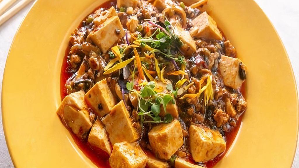 Ma Po Tofu (Ground Chicken) · New entrée. Tofu, peas, carrots, onions, straw mushroom in a spicy dried chili pepper, chili paste in our chef’s chili seared spicy sauce.