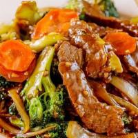 Beef With Broccoli · Beef sautéed with broccoli, white onions and carrots in a light garlic sauce.