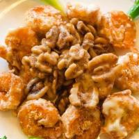 Walnut Shrimp · Shrimp with a light egg batter, sautéed with special white cream sauce with glazed walnuts a...