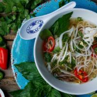 Pho · Rice noodle dipped into authentic Vietnamese broth, topped with onion and served on the side...