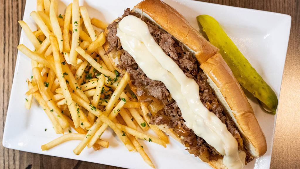 Philly Cheese Steak · With homemade whiz, grilled onions.