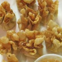 Crab Rangoon · Crispy won tons filled with crab meat, cream cheese, and Thai herbs and spices. Served with ...
