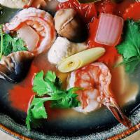 Tom Yum Large Bowl Soup · Thai spicy-and-sour soup with mushrooms, tomato, yellow onion, lemon grass and galanga, in a...