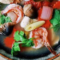 Tom Yum Small Bowl Soup · Thai spicy-and-sour soup with mushrooms, tomato, yellow onion, lemon grass and galanga, in a...