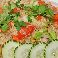 Thai Fried Rice · Jasmine white rice fried in a wok with yellow onion, egg, tomato, carrot, cabbage, pineapple...