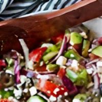 Greek Salad Bowl · Romaine lettuce, tomatoes, red onions, cucumbers, olives, feta cheese, pepperchine, and home...