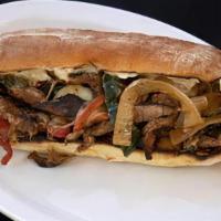 Philly Cheesesteak Torta Sandwich · Carne asada, peppers, onions, Swiss cheese, mayonniase, and scallions.