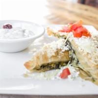 Spanakopita · Phyllo-baked baby spinach, feta, fresh herbs, and tomatoes. Served with tzatziki.