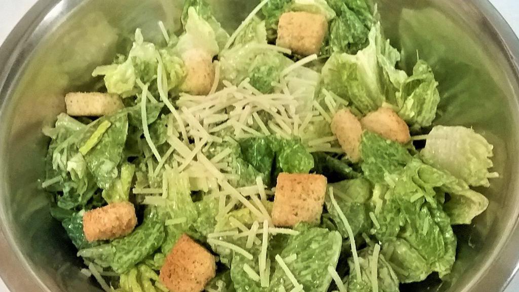 Caesar Salad · Chopped romaine, parmesan cheese, Caesar dressing and croutons.