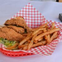 Catfish Po Boy · Fried catfish, lettuce, tomato, pickle, and Cajun mayo on a baguette.