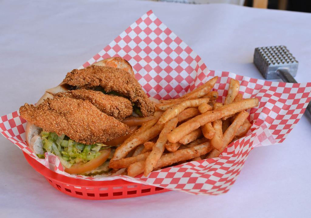 Catfish Po Boy · Fried catfish, lettuce, tomato, pickle, and Cajun mayo on a baguette.