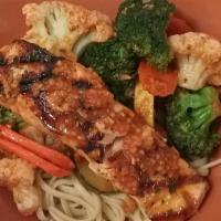 Grilled Salmon · Salmon fillet grilled with garlic butter and vegetables over rice or linguine.