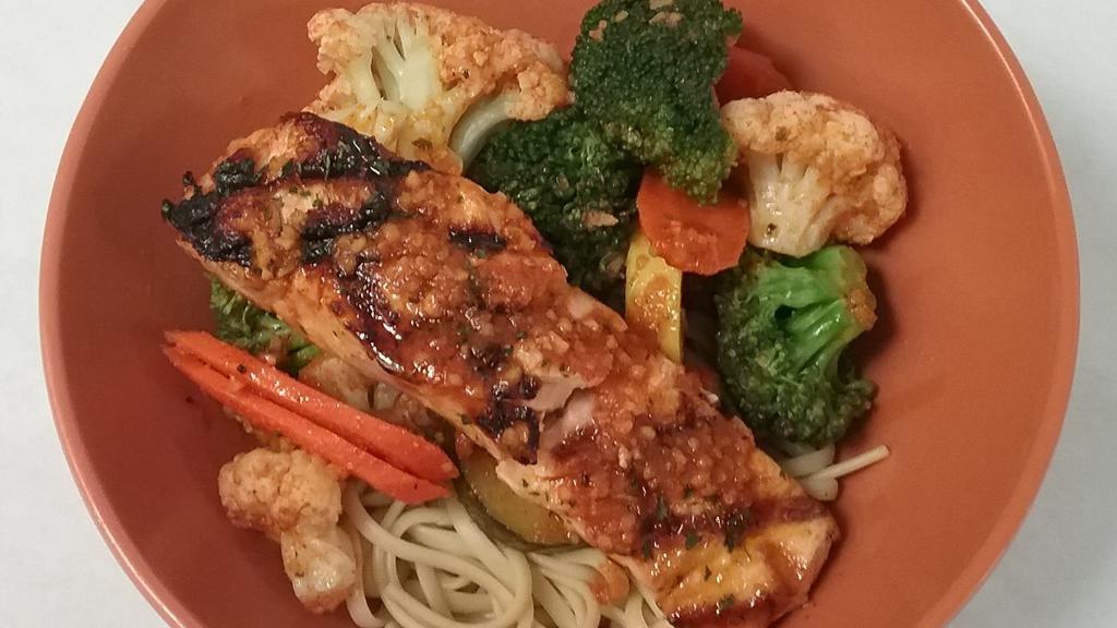 Grilled Salmon · Salmon fillet grilled with garlic butter and vegetables over rice or linguine.