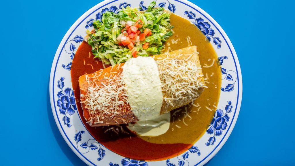 Bandera Burrito · Your choice of one of our delicious meats, pinto or black beans & rice, & fresh veggies wrapped in our large flour tortilla, doused with green sauce, red sauce, & jalapeño cream for a little fiery kick. Rice and beans inside the burrito. No exceptions.