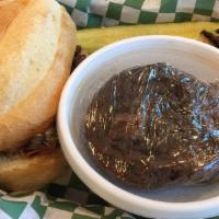French Dip · Grilled steak and onions with melted swiss cheese on a baguette with au jus.