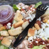 Cobb Salad · Romaine lettuce, chicken, bacon, blue cheese, egg, tomato, cucumber, home made croutons and ...