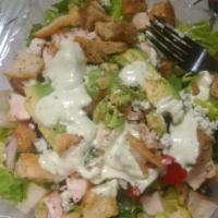 1/2 Basil Chicken Salad · Romaine lettuce with chicken, black olives, roasted red peppers, red onion, avocado, blue ch...