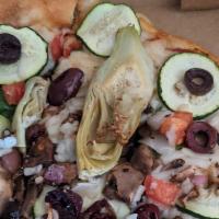Garden Pizza · Spinach, zucchini, fresh mushrooms, onions, artichoke hearts and roma tomatoes. Made with cr...