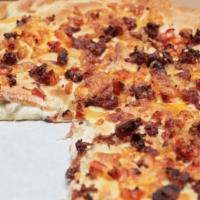 Wicked Chicken Pizza · Grilled chicken, bacon, onions and tomatoes. Topped with tomatoes, bacon and more cheese. Ma...