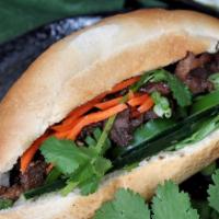 Banh Mi Vietnamese Sandwich · Pickled carrots, green onions, cilantro, sriracha, and mayonnaise.