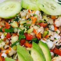 Ceviche · With your choice of shrimp or fish, cooked with lime juice, cilantro, onions, tomatoes, carr...