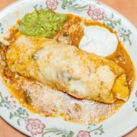 Burrito Colorado · Beef braised in a mild red sauce, rice, and beans. Wrapped in a flour tortilla, smothered wi...