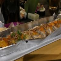 Volcano · Baked Seafood Dynamite over a California roll.

*Consuming raw or undercooked meats, poultry...