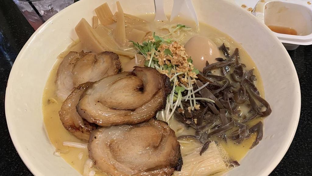 Shoyu Ramen · Kaiware, seaweed and pork in soy broth.