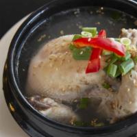 Ginseng Chicken Soup · 18 ounces whole chicken stuffed with rice, ginseng, dates, and chestnuts. Served with salt o...