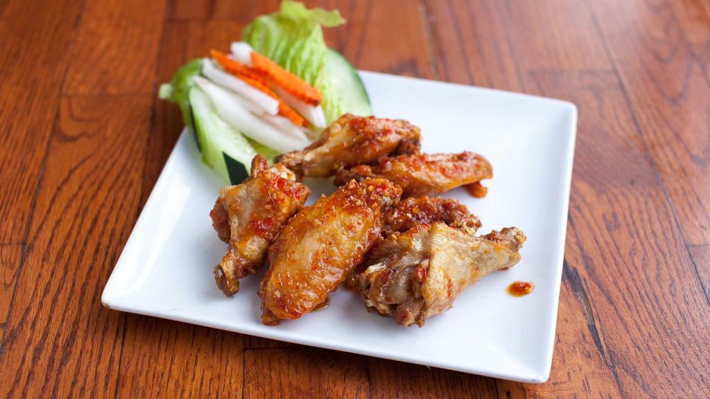 Butterfly Wings Rang · Fish or tamarind sauce party wings with rice, steamed mix broccoli, cabbage, and carrots.