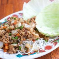 Lettuce Wraps · Tofu, pork or chicken, carrot, peas and crisp noodles.