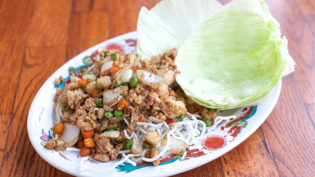 Lettuce Wraps · Tofu, pork or chicken, carrot, peas and crisp noodles.