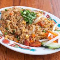 Cơm Chiên (Fried Rice) · Protein and rice in a wok of flame with eggs, peas, and carrots in tamari mirin sake sesame ...