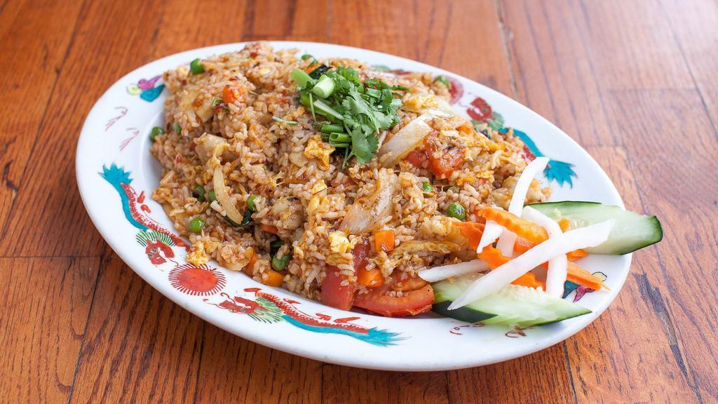Cơm Chiên (Fried Rice) · Protein and rice in a wok of flame with eggs, peas, and carrots in tamari mirin sake sesame spices. Gluten-MSG Free