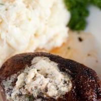 Filet Mignon - 8 Oz · topped with our signature steak butter and served with garlic mashed potatoes, jumbo baked p...