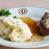 Filet Mignon - 12 Oz · topped with our signature steak butter and served with garlic mashed potatoes, jumbo baked p...