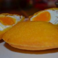 Egg Arepa · An Arepa made of corn flour that is stuffed with an egg and then deep fried.