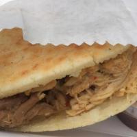 Mix Arepa · A grilled corn Arepa with our seasoned shredded chicken, beef and mozzarella cheese with our...