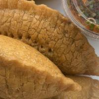 Veggie Empanada · 2 empanadas filled with mashed potatoes, cut mushrooms, cut bell pepper, spinach, onion and ...