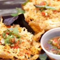 Chicken Patacon · 2 Savory fried plantain cups with our seasoned shredded chicken, mozzarella cheese, mixed gr...