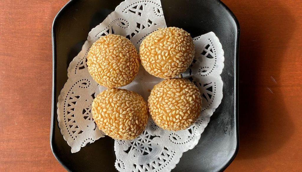 Sesame Balls · (4) Deep fried sesame balls made with sticky rice and filled with red bean paste .
