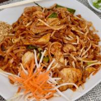 Pad Thai · Thin rice noodles with choice of meat, egg, green onions, and bean sprouts. Topped with shre...