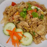 Thai Fried Rice · Classic fried rice with choice of meat, egg, tomatoes, white onions topped with green onions...