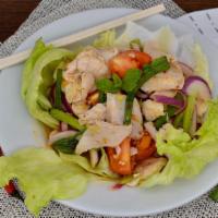 Yum Salad (Sliced Meat) · Thin-cut meat or tofu with shredded carrots, cucumbers, lettuce, tomatoes, green and red oni...