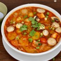Tom Yum Soup · Savory tom yum broth with choice of meat, lemongrass, mushroom, tomatoes, and white onions t...