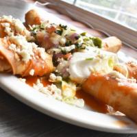 Juan’S Taquitos · Deep fried corn tortillas with choice of chicken or shredded beef. Served on a bed of lettuc...