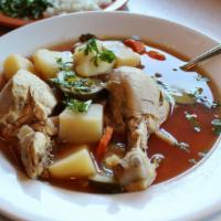 Caldo De Pollo · Whole chicken pieces in a hot soup with vegetables.