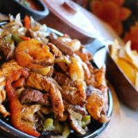 Fajitas Mixtas · Prawns and grilled halibut sautéed with Mexican spices delivered with a delicious mixture of...