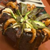 Molcajete · Mortar rock filled with grilled chicken, chorizo, steak, shrimp, slices of Mexican cheese, c...